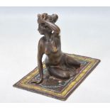 20TH CENTURY VIENNA BRONZE FIGURINE OF A LADY ON A RUG