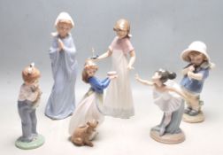 SIX VINTAGE NAO BY LLADRO CERAMIC FIGURINES