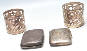 TWO HALLMARKED SILVER CIGARETTE CASES, TOGETHER WITH A PAIR OF SILVER LINERS.