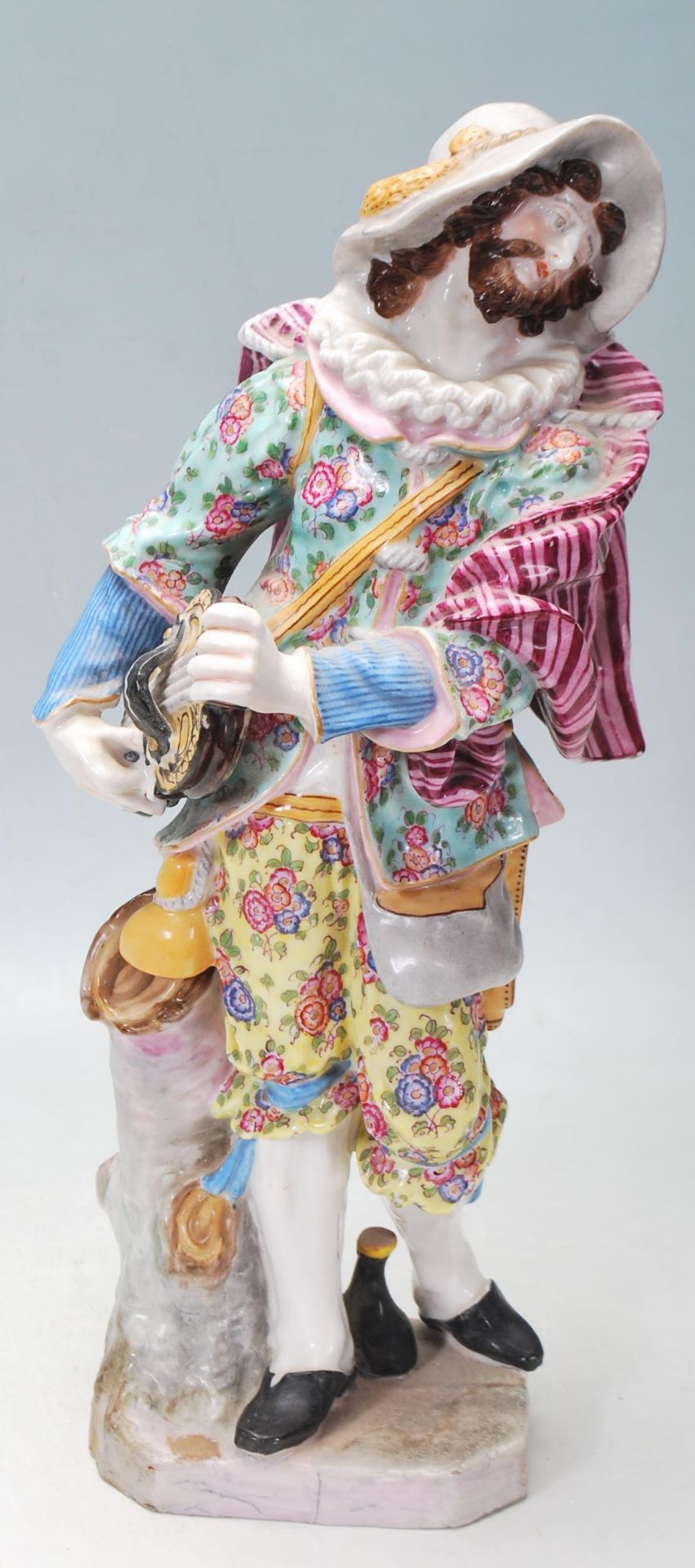 A BELIEVED 18TH CETURY MEISSEN STYLE CERAMIC PORCELAIN FIGURINES WITH MEISSEN BLUE CROSSED SWARD