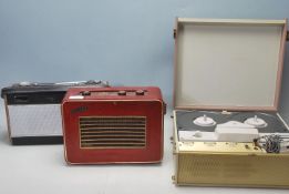 A COLLECTION OF VINTAGE RETRO AUDIO EQUIPMENT TO INCLUDE TWO RADIOS AND A REEL TO REEL.