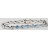 CONTEMPORARY SILEVR AND BLUE STONE TENNIS BRACELET