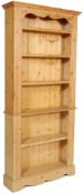 A 20TH CENTURY ANTIQUE STYLE OPEN WINDOW PINE BOOKCASE