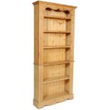 A 20TH CENTURY ANTIQUE STYLE OPEN WINDOW PINE BOOKCASE