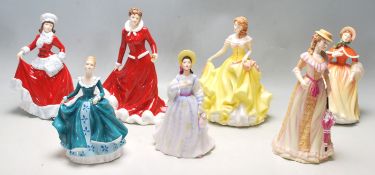 A GROUP OF SEVEN ROYAL DOULTON CERAMIC FIGURINES - HN 5322 - HN 5321 - HN 5314 - HN 5323 - HN 5229 -