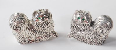 A PAIR OF SILVER PLATED CAT SALT AND PEPPER SHAKERS