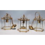 GROUP OF THREE 20TH CENTURY ANTIQUE STYLE BRASS AND GLASS PORCH LANTERNS