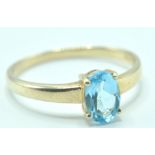 9CT GOLD AND BLUE STONE SOLITAIRE RING