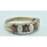 9CT GOLD RUBY AND OPAL CABOCHON 7 STONE RING