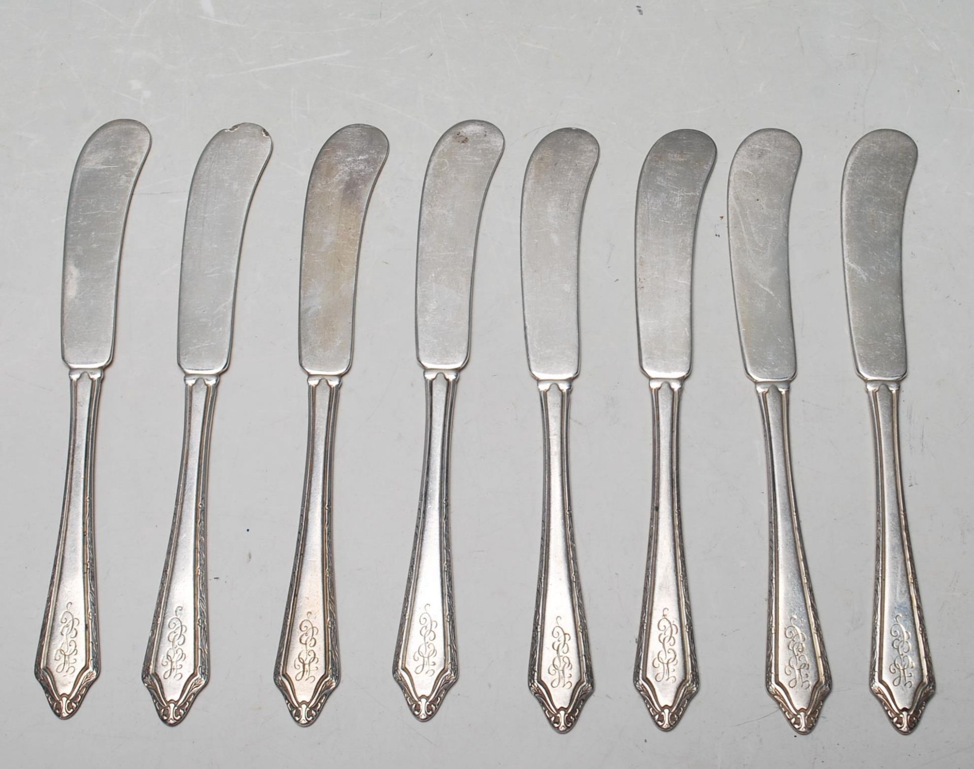 SET OF NINE AMERICAN SILVER BUTTER KNIVES