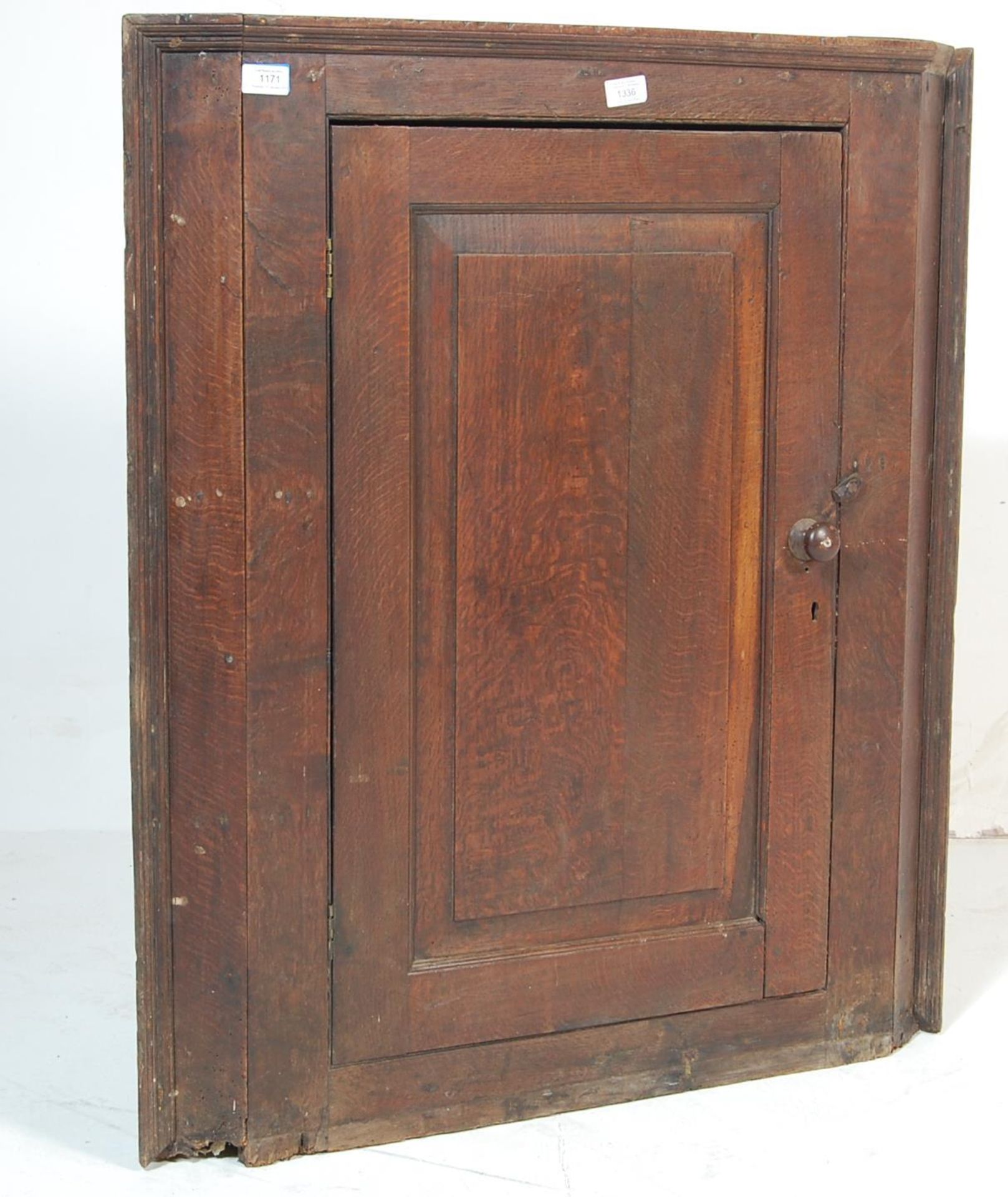 A George III 19th century country oak hanging corner cabinet