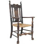 EARLY 20TH CENTURY ARTS AND CRAFTS CARVED OAK CHAIR IN THE MANNER OF DANIEL MAROT