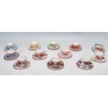 TWELVE ROYAL WORCESTER MINIATURE TEA CUPS AND SAUCERS