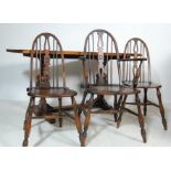 1920'S OAK REFECTORY DINING TABLE AND ARCHED BACK CHAIRS