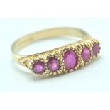 9CT GOLD AND PINK STONE FIVE STONE RING