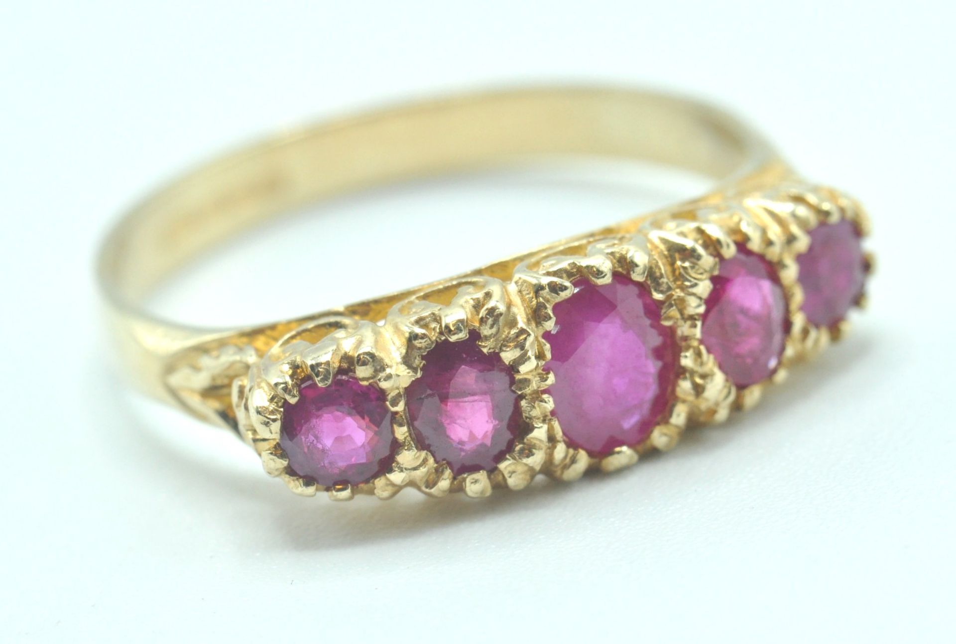 9CT GOLD AND PINK STONE FIVE STONE RING