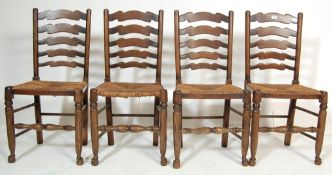 FOUR EARLY 20TH CENTURY OAK FARMHOUSE LADDERBACK DINING CHAIRS