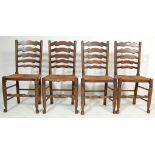 FOUR EARLY 20TH CENTURY OAK FARMHOUSE LADDERBACK DINING CHAIRS