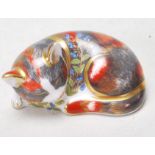 A ROYAL CROWN DERBY 'CATNIP KITTEN' PAPERWEIGHT.