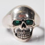 SILVER SULL RING SET WITH GREEN STONE EYES