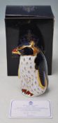 A ROYAL CROWN DERBY ROCKHOPPER PENGUIN PAPERWEIGHT WITH GOLD STOPPER