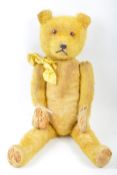 1950'S VINTAGE ENGLISH STRAW FILLED TEDDY BEAR