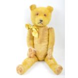 1950'S VINTAGE ENGLISH STRAW FILLED TEDDY BEAR