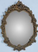 ANTIQUE VICTORIAN STYLE GILDED WALL MIRROR OF OVAL FORM