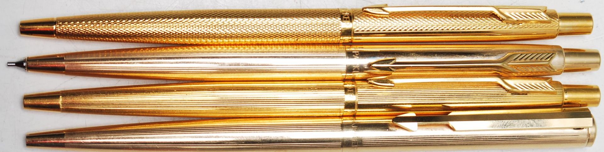 COLLECTION OF FOUR VINTAGE GOLD PLATED PARKER WRITING PENS