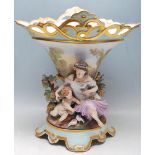 ANTIQUE PORCELAIN AND BISQUE FIGURINE VASE