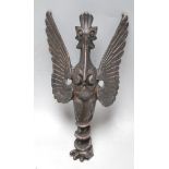 AN UNUSUAL 20TH CENTURY FIGURE IN THE FORM OF A WINGED ANIMAL / DEITY. SPELTER AND PEWTER.