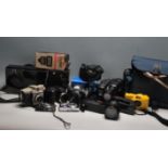 A large collection of vintage camera equipment to include a Kodak box brownie, Sony Ericcson cyber