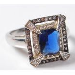 LARGE .925 LADIES DRESS RING HAVING A LARGE CENTRAL BLUE STONE