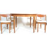 1970’S TEAK WOOD CIRCULAR EXTENDING DINING TABLE AND FOUR CHAIRS