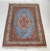 20TH CENTURY TURKISH / ISLAMIC CARPET RUG WITH SINGLE MEDALLION ON A BLUE FIELD