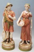 PAIR OF 20TH CENTURY ROYAL DUX CERAMIC FIGURINES