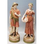 PAIR OF 20TH CENTURY ROYAL DUX CERAMIC FIGURINES