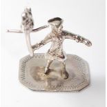 SILVER FIGURE OF A PIRATE HOLDING A PARROT