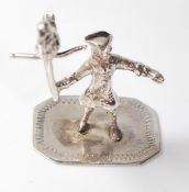 SILVER FIGURE OF A PIRATE HOLDING A PARROT