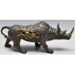 A 20TH CENTURY CHINESE BRONZE RHINO