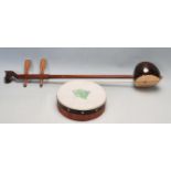 CHINESE ORIENTAL ERHU MUSICAL INSTRUMENT AND A HAND DRUM