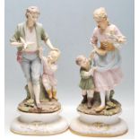 PAIR OF 20TH CENTURY BISQUE PORCELAIN FIGURINES