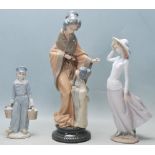 THREE VINTAGE LATE 20TH CENTURY PORCELAIN FIGURINES BY LLADRO AND NAO