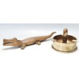LARGE BRASS CROCODILE NUT CRACKER AND A LARGE WWII TRENCH ART ASHTRAY
