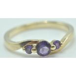 9CT GOLD AND AMETHYST THREE STONE RING