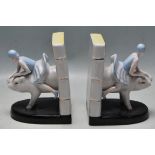 A PAIR OF ART DECO STYLE CERAMIC BOOKENDS