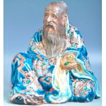19TH CENTURY CHINESE GLAZED FIGURE OF A SEATED ELDER