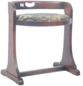 ARTS & CRAFTS OAK OVAL LOW CHAIR OF OVAL FORM