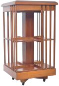 YEW AND MAHOGANY TWO TIER REVOLVING BOOKCASE