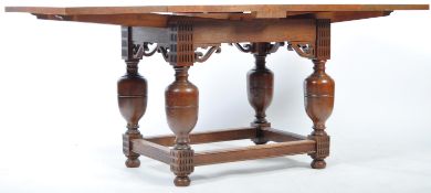 ARTS AND CRAFTS OAK DRAW LEAF DINING TABLE RAISED ON CUP & COVER SUPPORTS